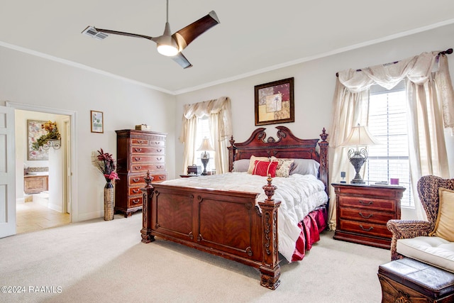 carpeted bedroom featuring ceiling fan, ornamental molding, and ensuite bathroom