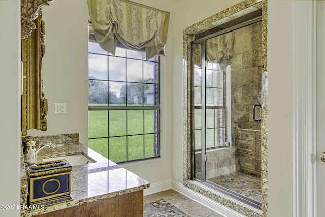 415 Fort Hamilton Dr, Opelousas, LA 70570 - full bath with baseboards, a stall shower, and a sink