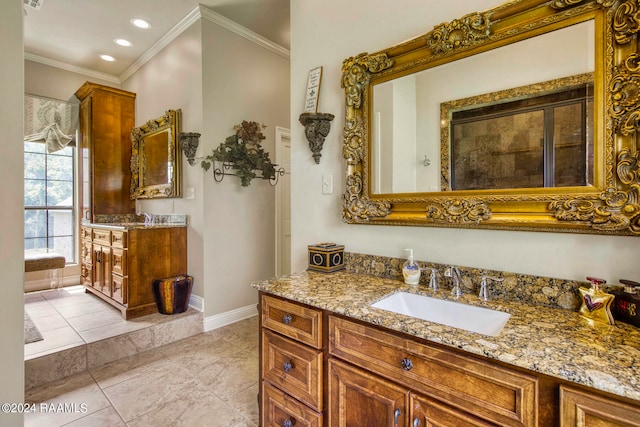 bathroom featuring tile patterned flooring, vanity, and ornamental molding