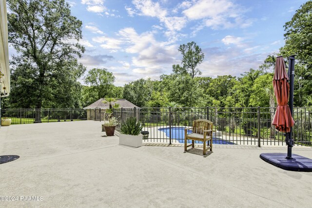 415 Fort Hamilton Dr, Opelousas, LA 70570 - view of swimming pool featuring a patio, a fenced in pool, and fence