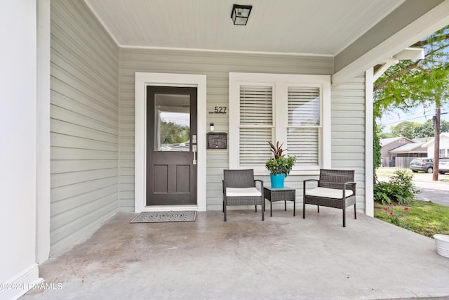 entrance to property featuring a porch