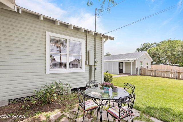 view of patio featuring fence