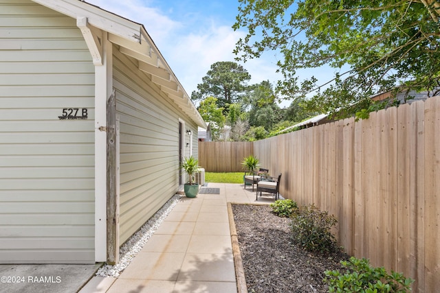 exterior space with a patio area and a fenced backyard