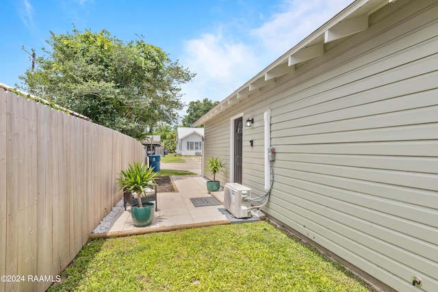 view of yard featuring a patio, ac unit, and fence