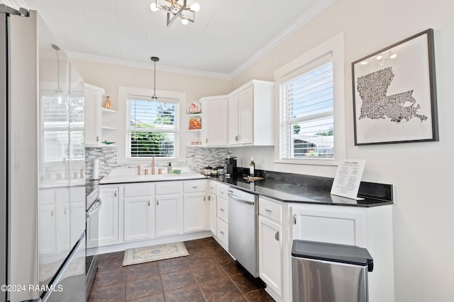 kitchen with a sink, white cabinetry, appliances with stainless steel finishes, decorative backsplash, and open shelves