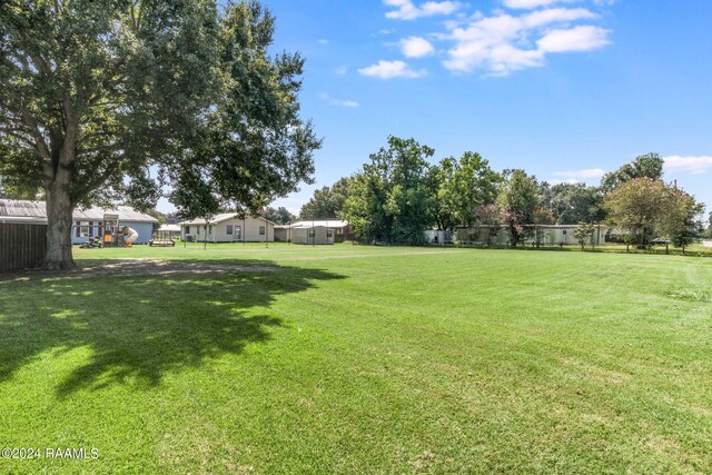 935 Pearl St, Rayne, LA 70578 - view of yard with fence