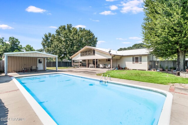 935 Pearl St, Rayne, LA 70578 - view of swimming pool with a fenced in pool, a patio area, a yard, and fence