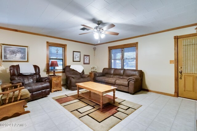935 Pearl St, Rayne, LA 70578 - living area featuring visible vents, crown molding, baseboards, and ceiling fan