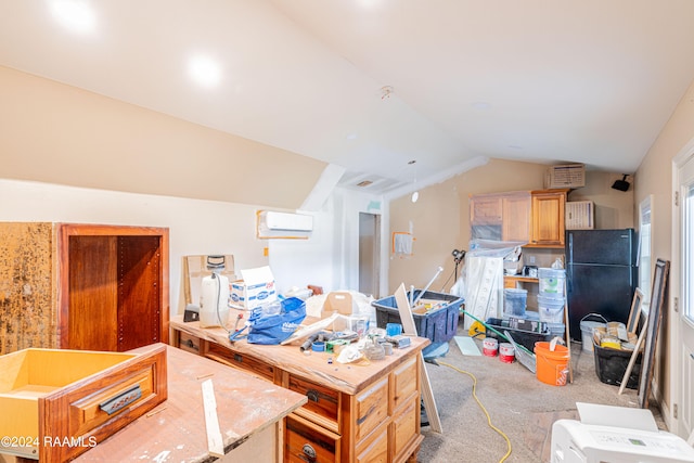 kitchen with light carpet, light brown cabinets, a wall mounted AC, vaulted ceiling, and black refrigerator