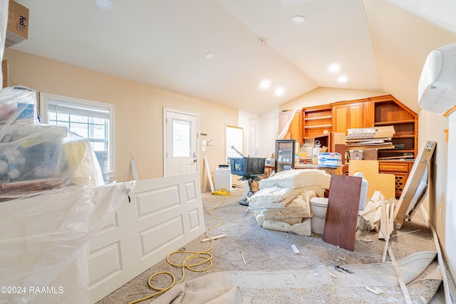 dining space with vaulted ceiling and light colored carpet