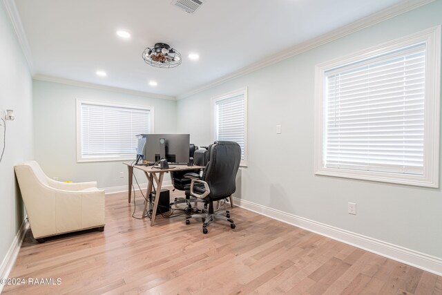 office area with ornamental molding and light wood-type flooring