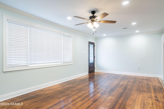 spare room with ceiling fan, ornamental molding, and dark hardwood / wood-style flooring