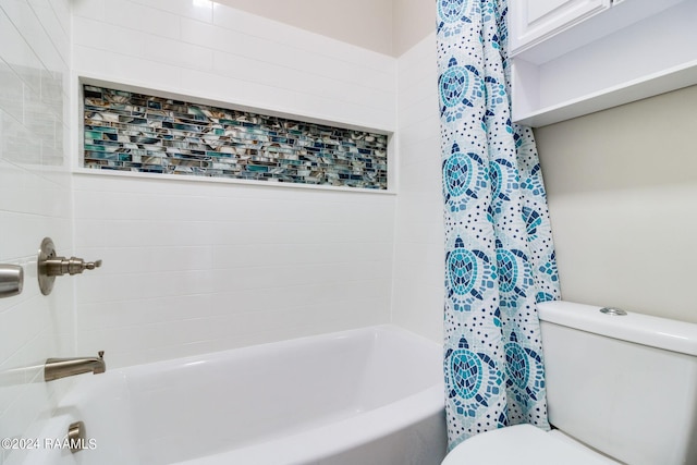 bathroom featuring toilet and shower / bath combo with shower curtain