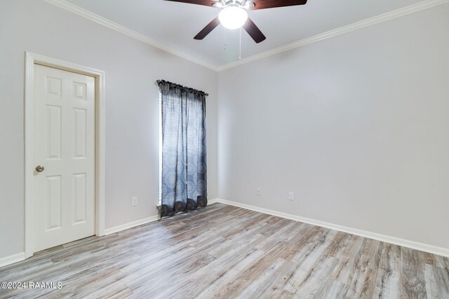 empty room with ceiling fan, light wood-type flooring, and ornamental molding