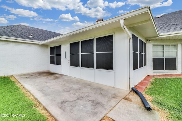 back of property featuring a patio area