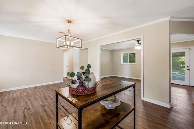 dining room featuring ceiling fan with notable chandelier, ornamental molding, and hardwood / wood-style flooring