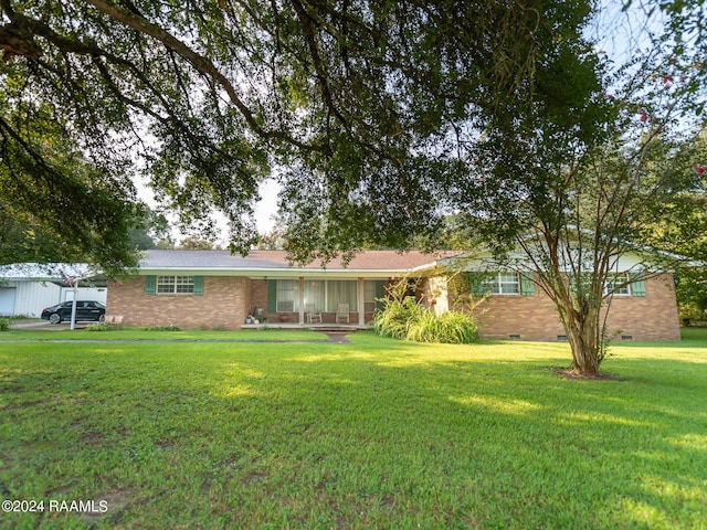 4661 St Landry Hwy, Ville Platte, LA 70586 - ranch-style house with a carport, a front yard, crawl space, and brick siding