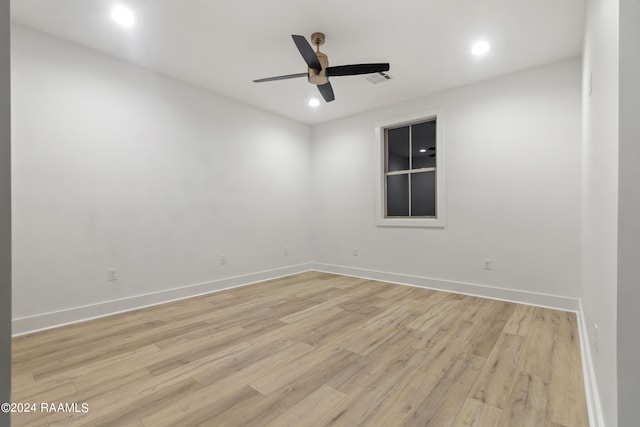 empty room featuring light hardwood / wood-style flooring and ceiling fan