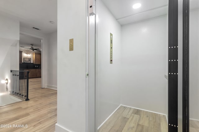 hallway with light wood-type flooring