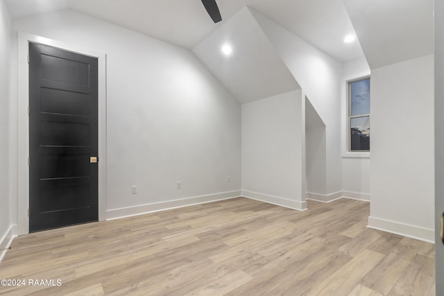 bonus room with light hardwood / wood-style flooring, lofted ceiling, and ceiling fan