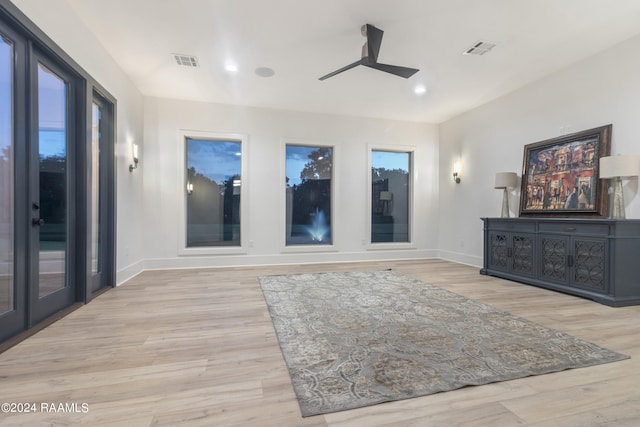 interior space featuring light wood-type flooring and ceiling fan