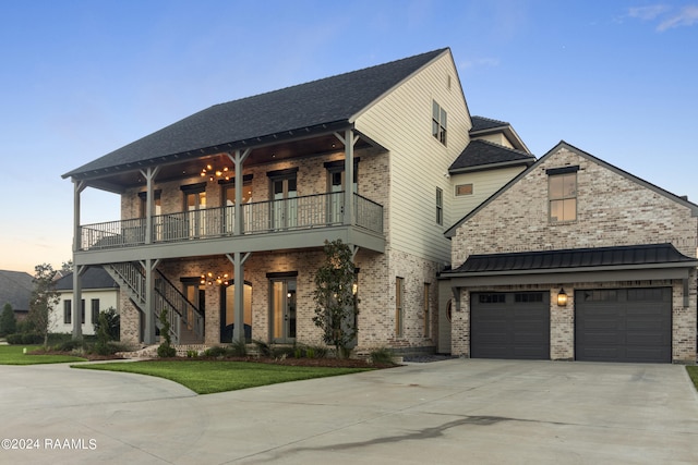 view of front of house with a balcony and a garage