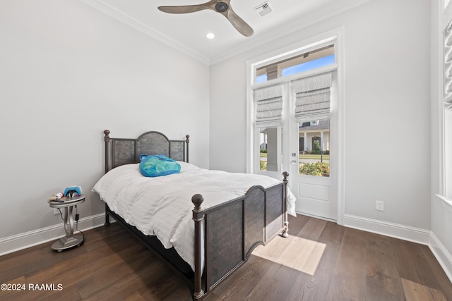 bedroom with dark wood-type flooring, ceiling fan, and ornamental molding