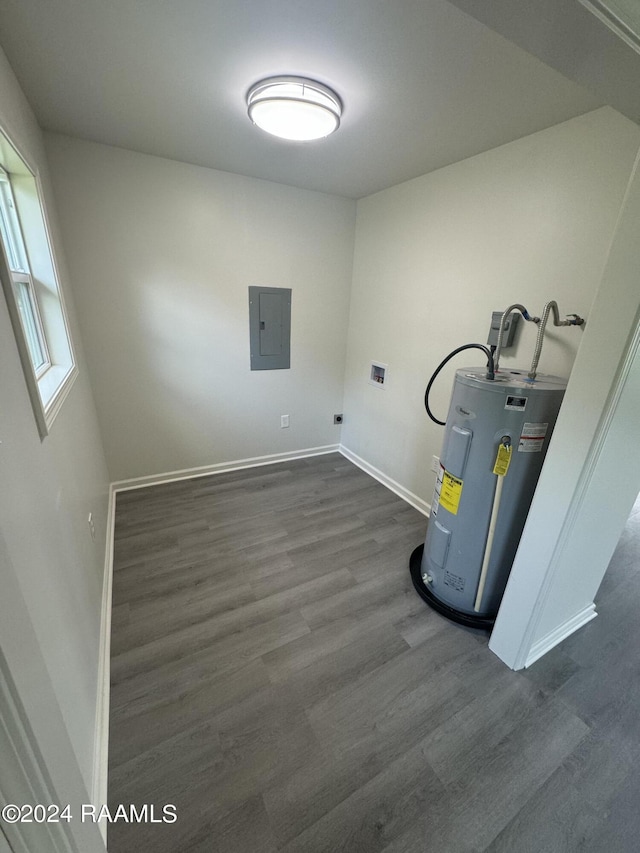 utility room with electric panel and electric water heater