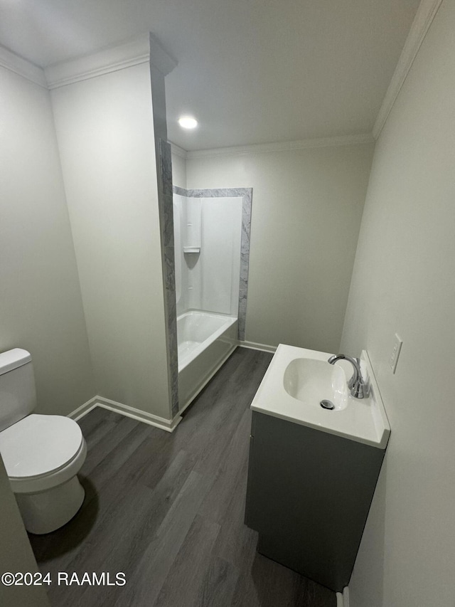 full bathroom with ornamental molding, vanity, toilet, and hardwood / wood-style floors