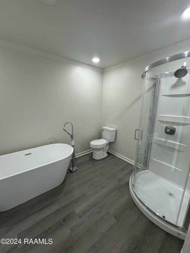 bathroom with wood-type flooring, ornamental molding, toilet, and plus walk in shower