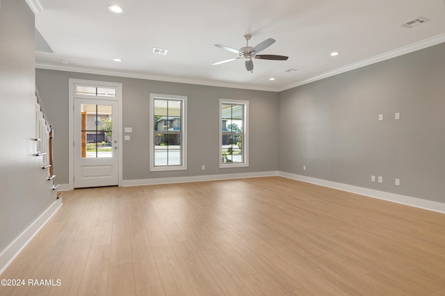 unfurnished room featuring light hardwood / wood-style flooring, crown molding, and ceiling fan