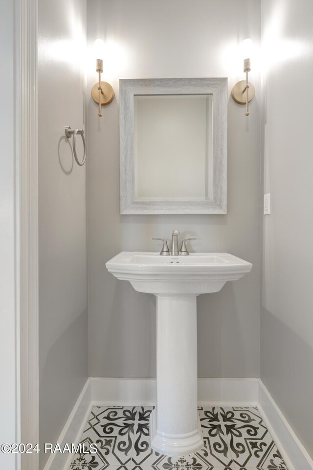 bathroom with tile patterned floors