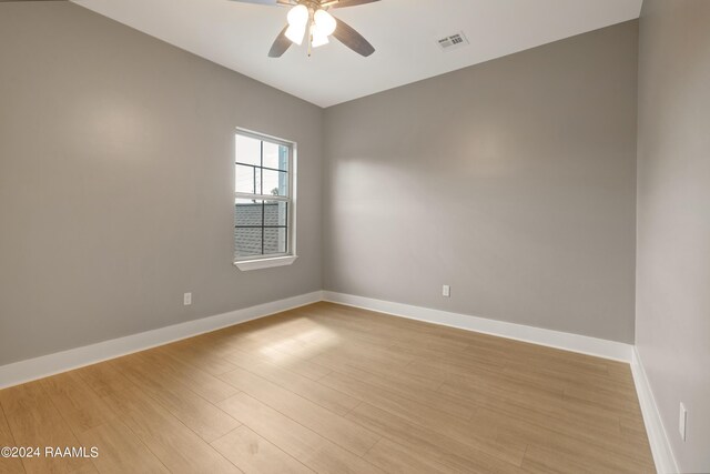 unfurnished room featuring ceiling fan and light wood-type flooring