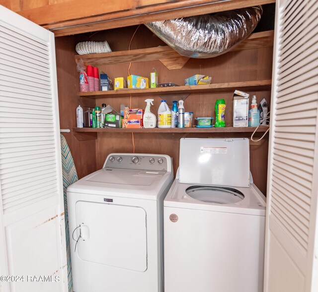 clothes washing area with independent washer and dryer