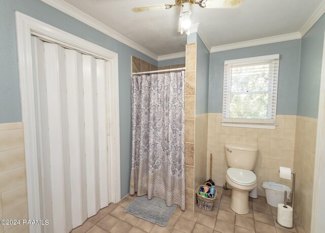 bathroom featuring tile walls, tile patterned flooring, ornamental molding, and toilet