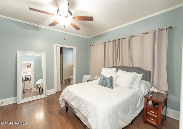 bedroom featuring ceiling fan, connected bathroom, dark hardwood / wood-style flooring, and crown molding