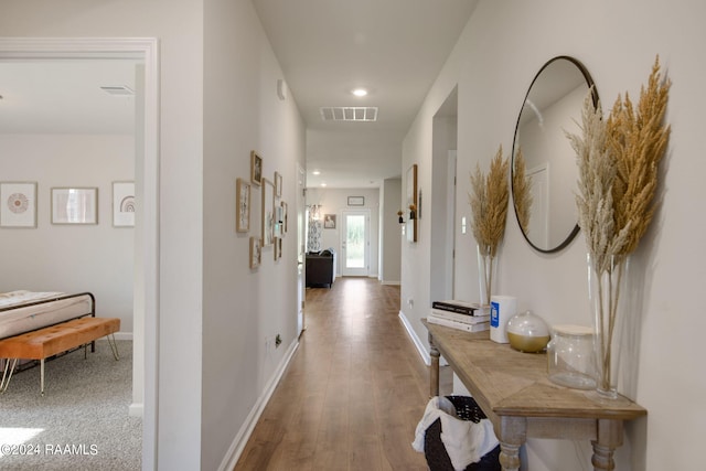 corridor featuring hardwood / wood-style flooring