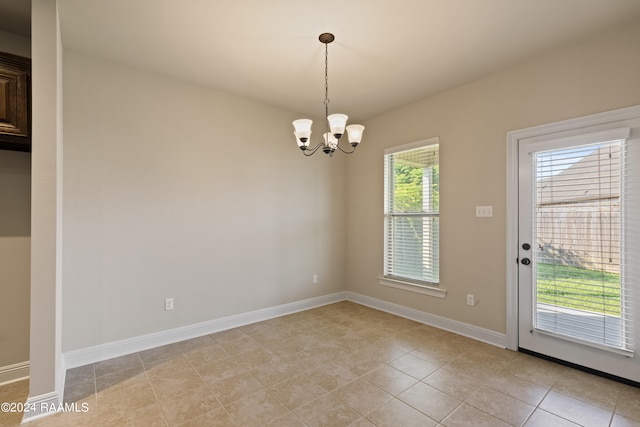 interior space with an inviting chandelier and light tile patterned flooring