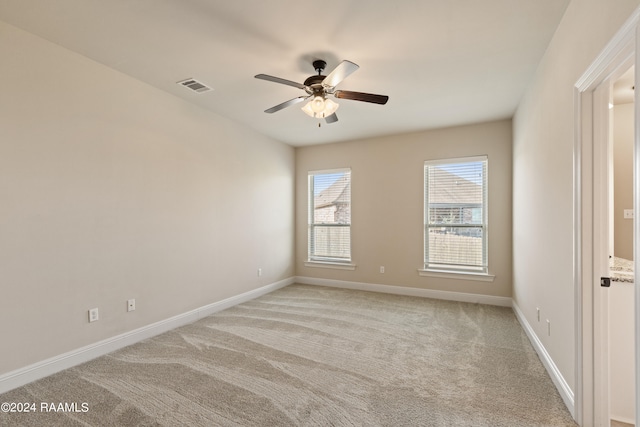 carpeted empty room with ceiling fan