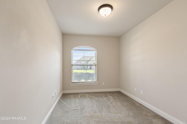 empty room with carpet flooring