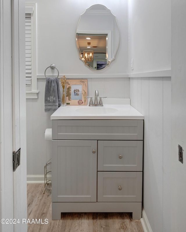 bathroom with vanity and hardwood / wood-style flooring