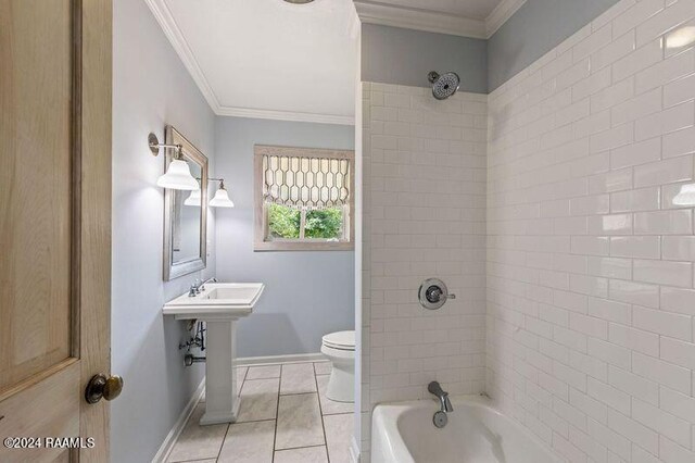 bathroom featuring ornamental molding, tile patterned floors, tiled shower / bath, and toilet