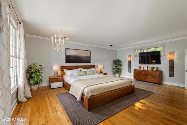 110 Charles Read Ave, Lafayette, LA 70503 - bedroom featuring a chandelier, light wood-type flooring, crown molding, and multiple windows
