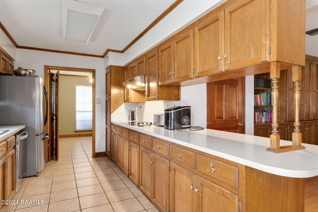 kitchen with light tile patterned flooring, appliances with stainless steel finishes, kitchen peninsula, and ornamental molding