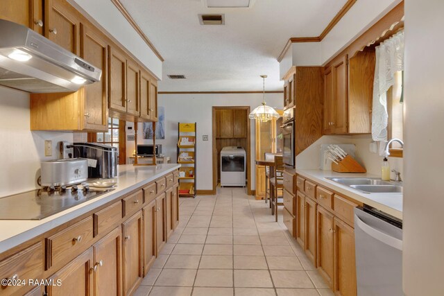 kitchen with crown molding, pendant lighting, stainless steel appliances, and sink