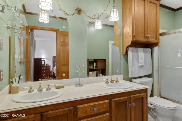 bathroom featuring ornamental molding, vanity, and toilet