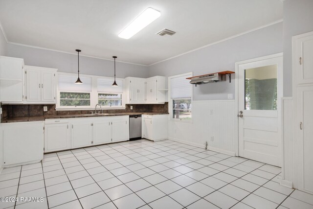 kitchen featuring dishwasher, light tile patterned floors, tasteful backsplash, and hanging light fixtures