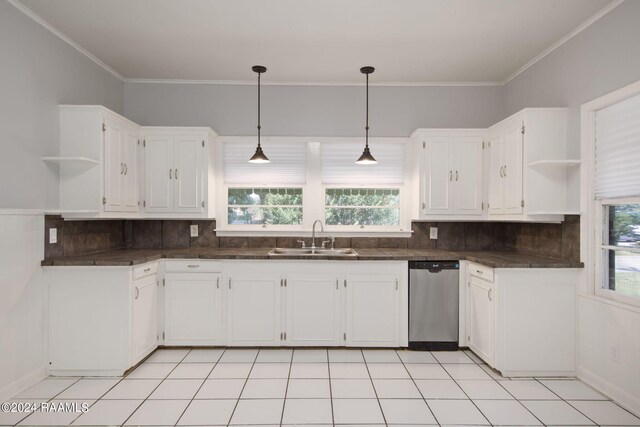 kitchen with sink, plenty of natural light, stainless steel dishwasher, and backsplash