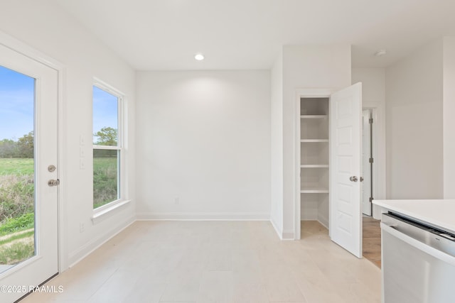 unfurnished dining area featuring baseboards and recessed lighting