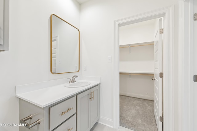 bathroom featuring vanity and baseboards